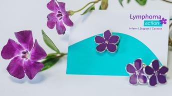 Purple periwinkle pin badge with flowers