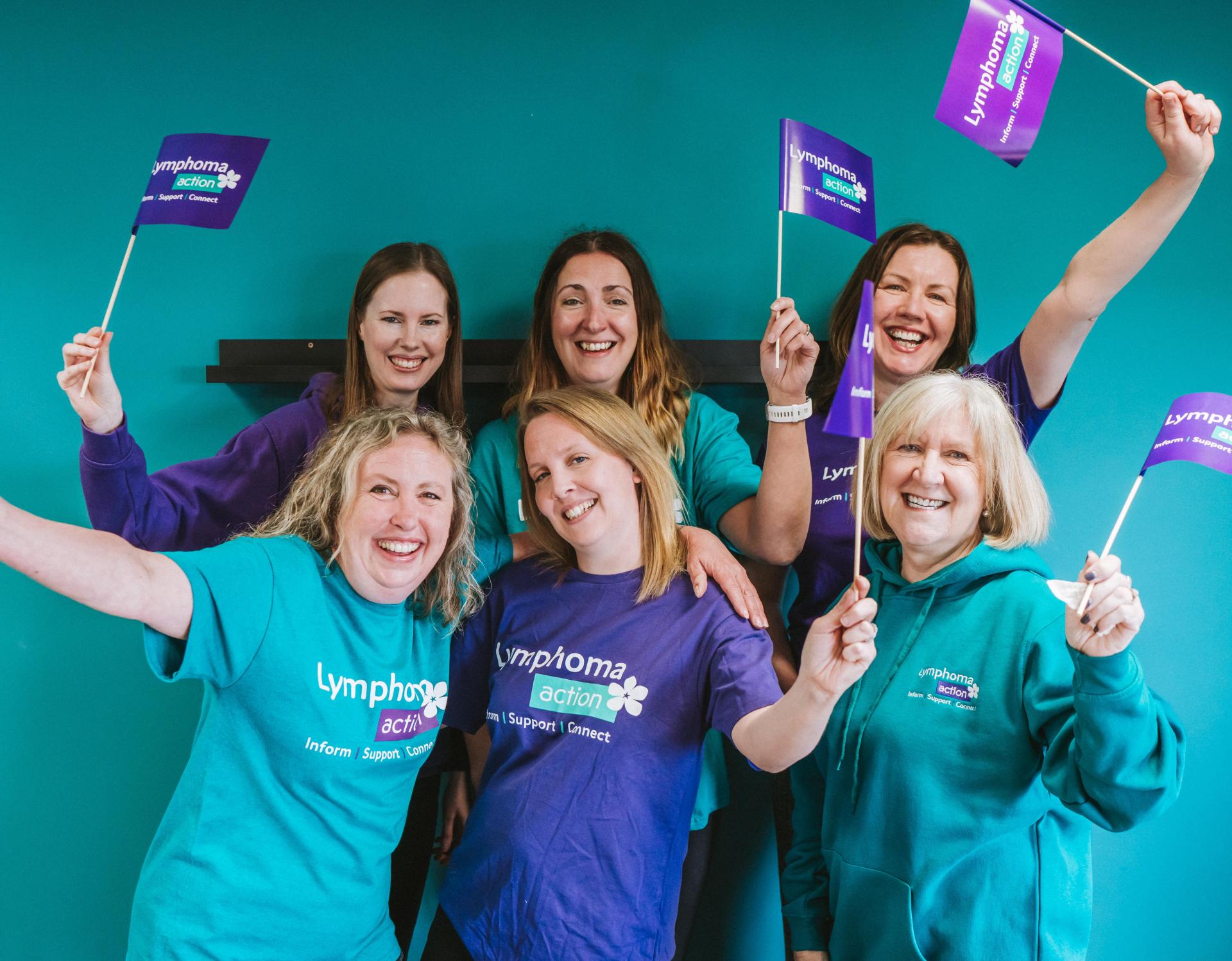 Lymphoma Action staff waving flags