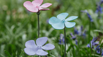 Three metal periwinkle sculptures