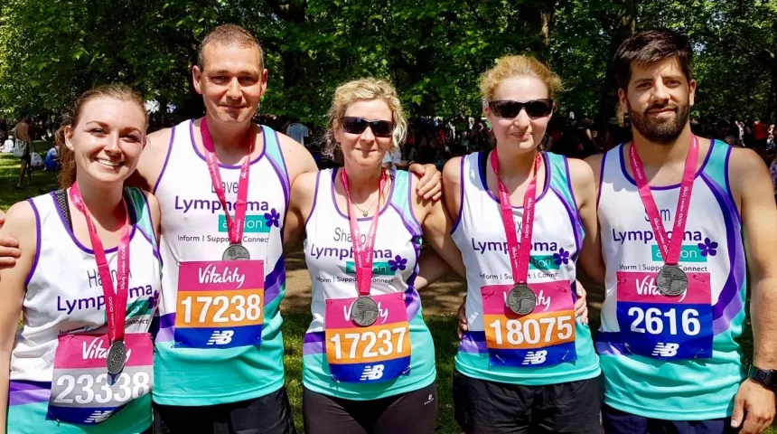 Group of runners with medals