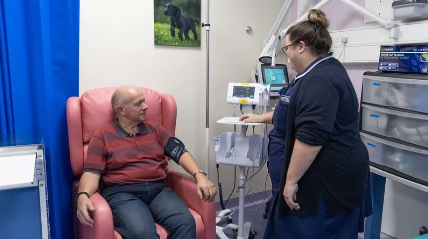 Man in clinic setting have treatment with nurse