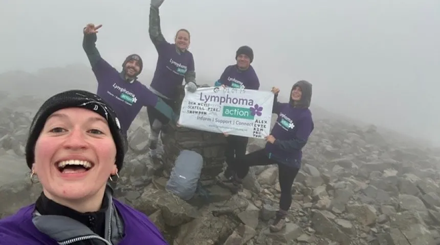 lymphoma action walkers at the top of mountain in the clouds