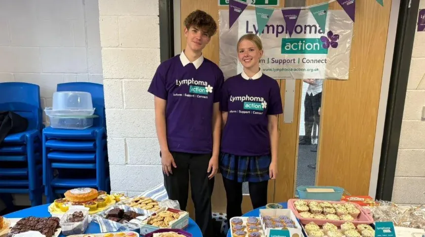 boy and girl in lymphoma Action t-shirt at a school bake sale 