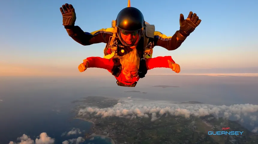 Freefall skydiver in sunset